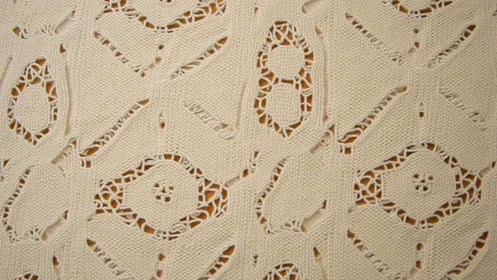 Antique bobbin lace with floral and scrolling patterns